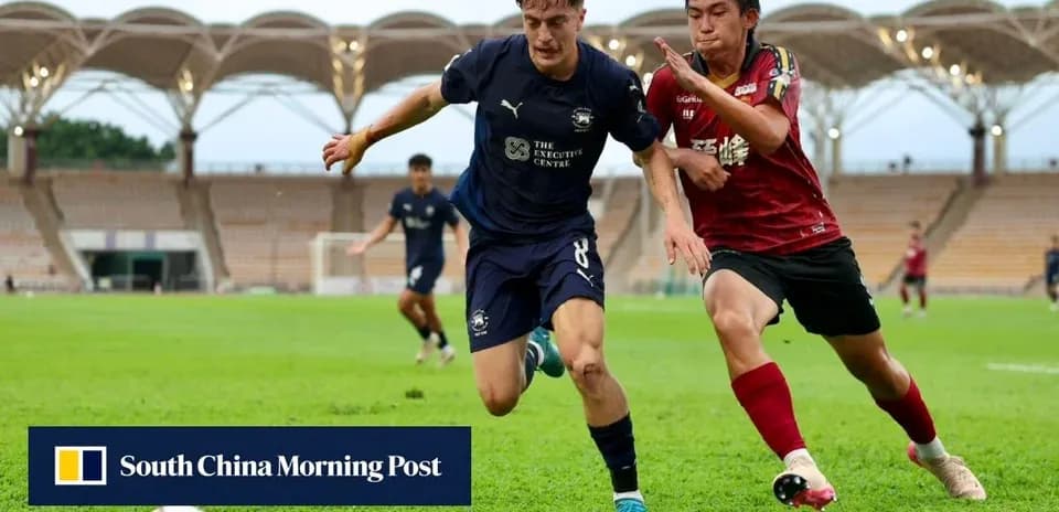 Player in blue jersey pursued by opponent in red jersey