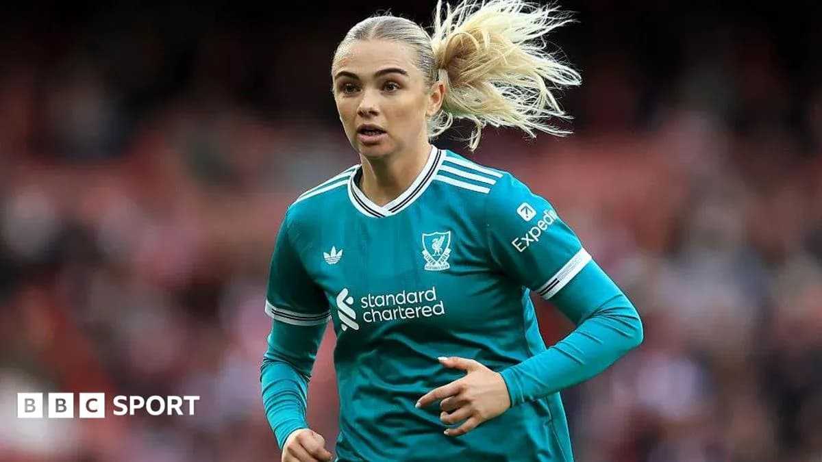 Player in teal kit running on the pitch