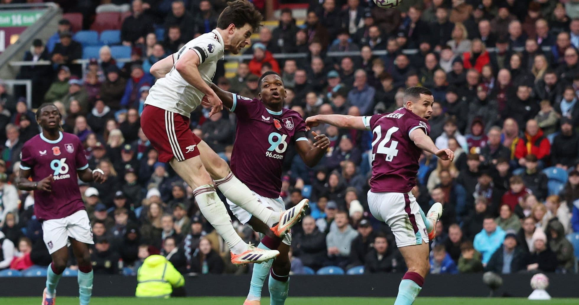 Arsenal player attempting a header against Burnley