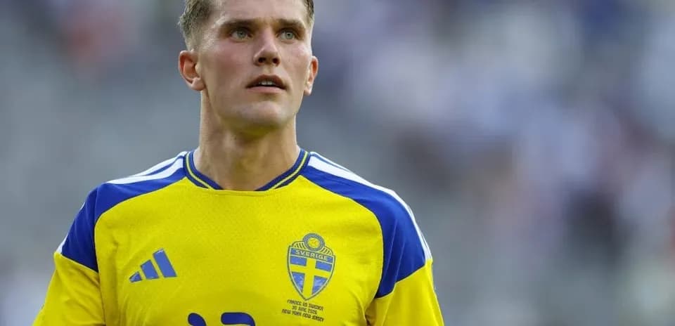 Player in yellow Sweden jersey on field