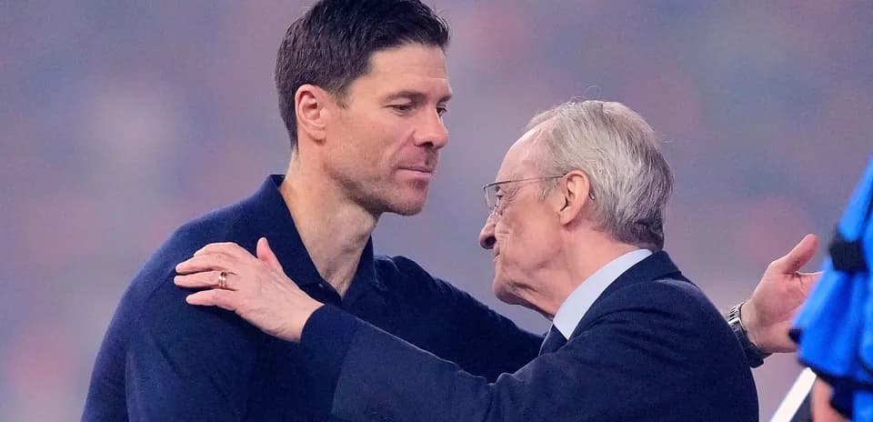Two men embracing on a sports field