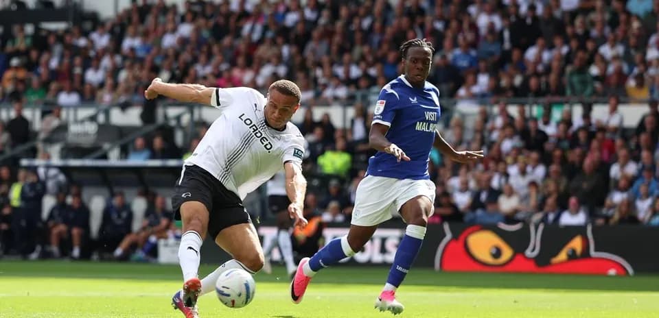 Player kicking the ball during match action