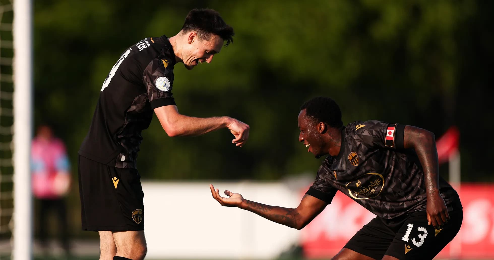 Players celebrating a goal during match