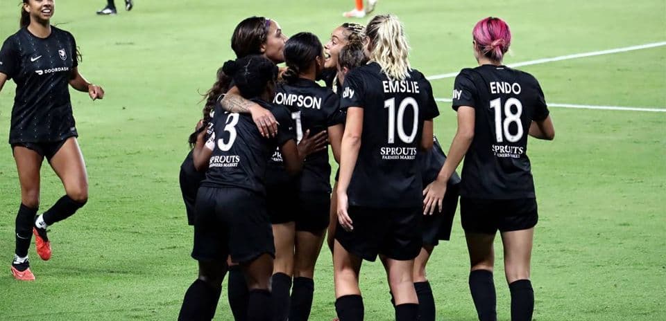 Players celebrating a goal during match
