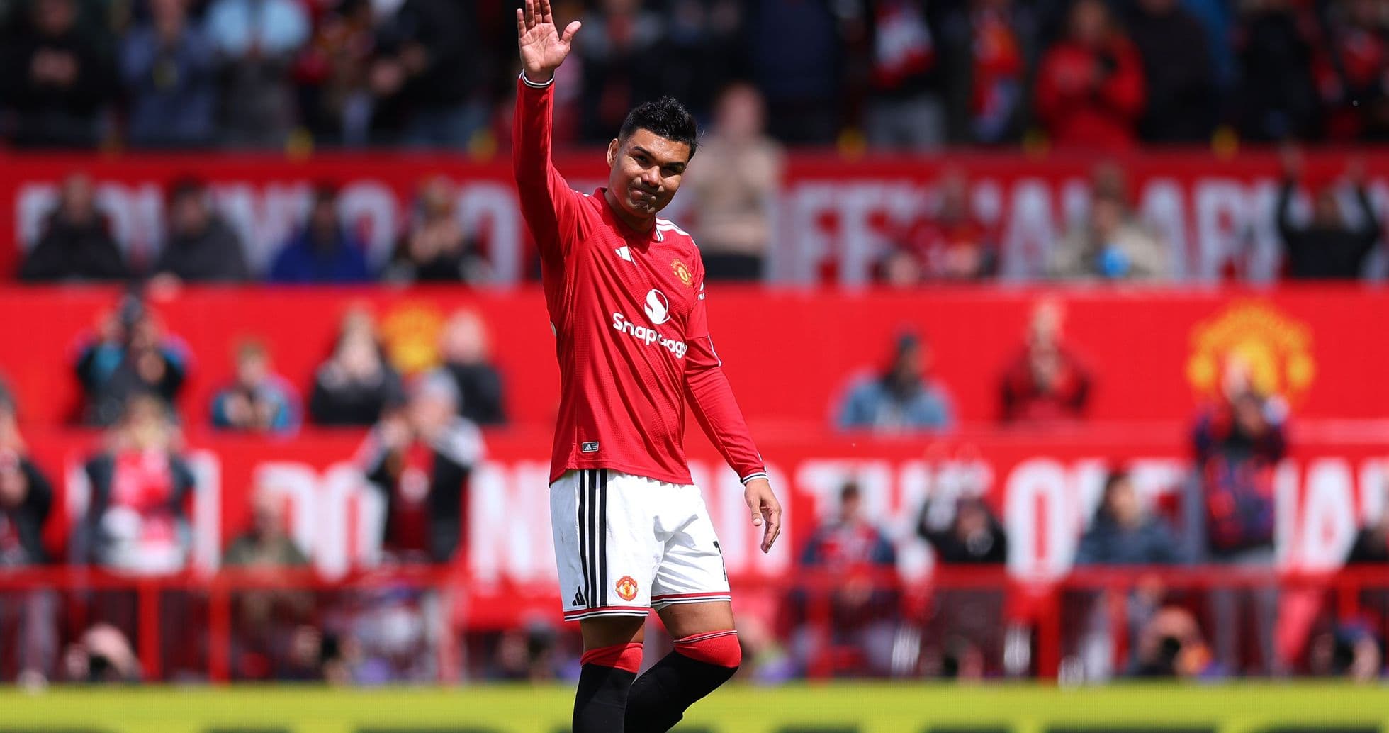 Player waving to fans during match at stadium