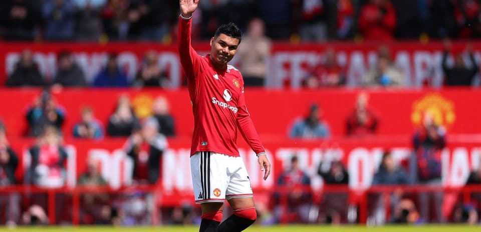Player waving to fans during match at stadium