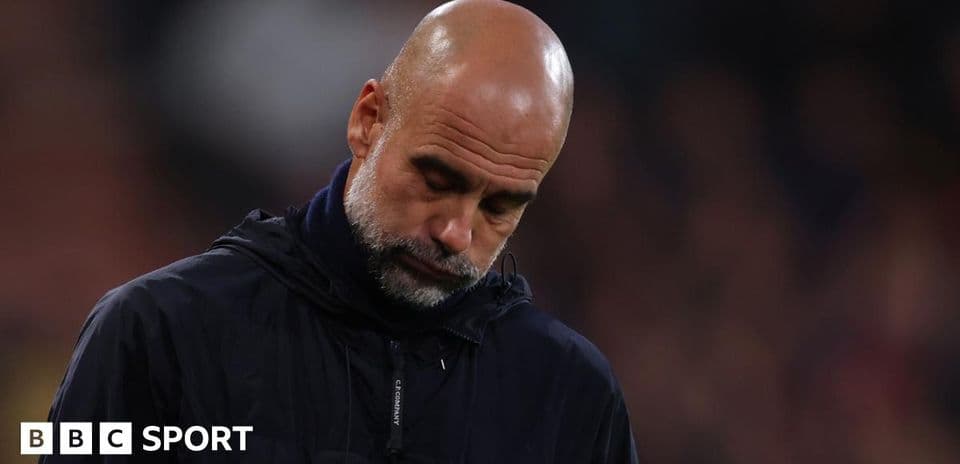 Manager looking down during match on sidelines