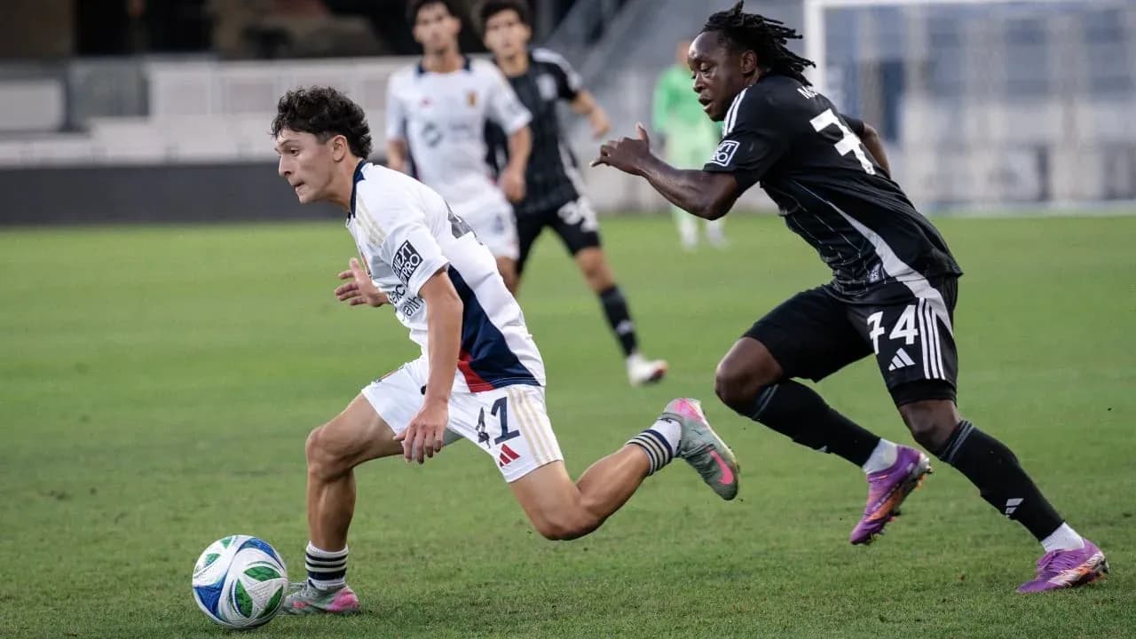 Player running with ball during MLS Next Pro match