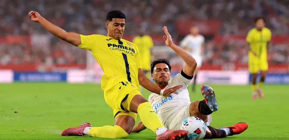 Two players challenging for the ball during match