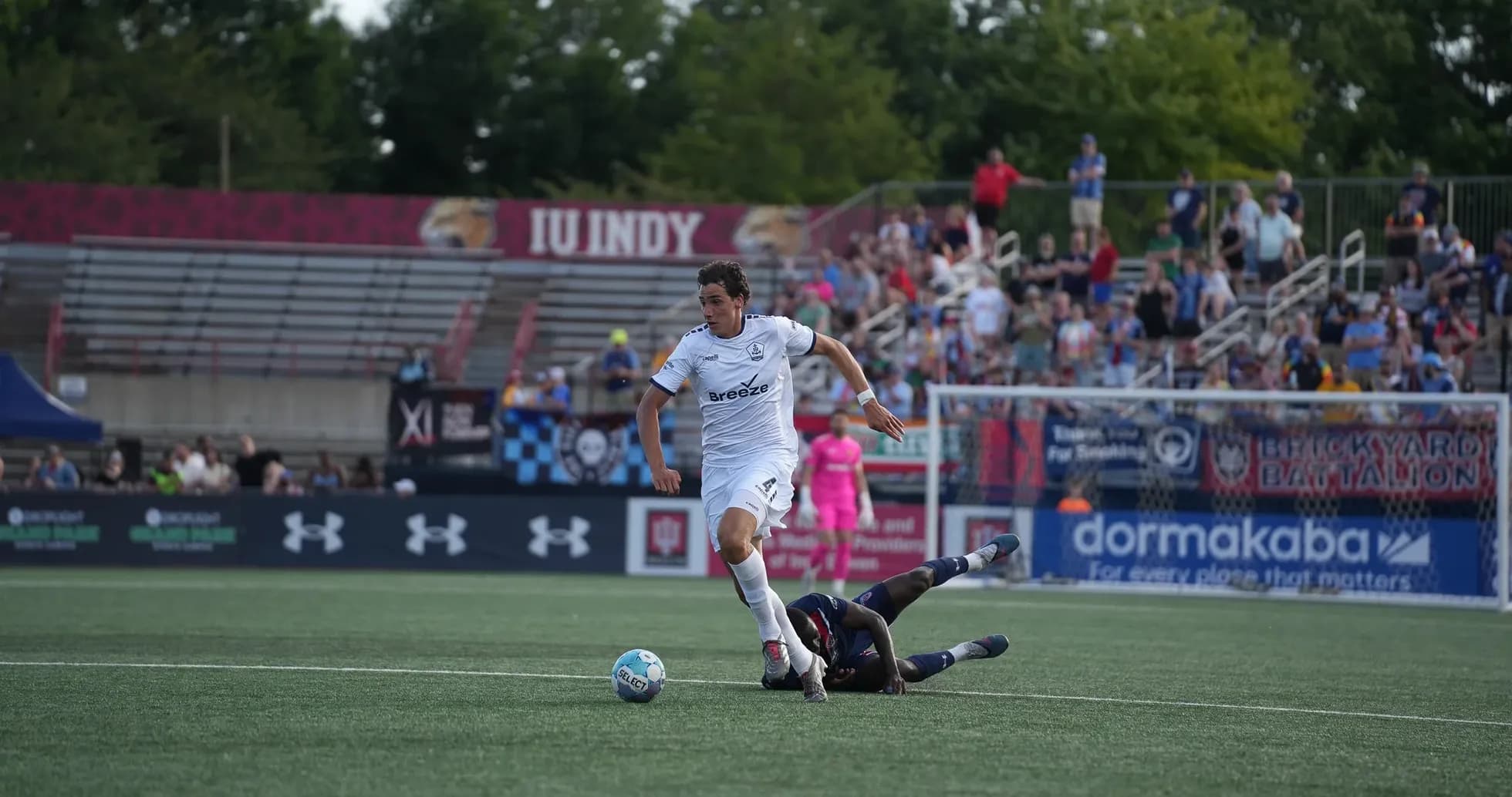 Player tackling during Rhode Island vs Westchester SC match