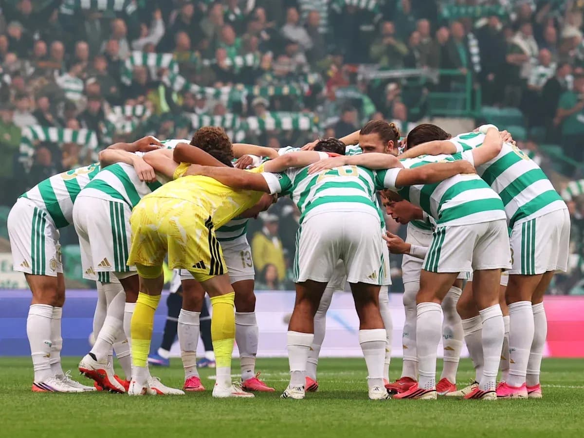 Celtic players huddled together before the match