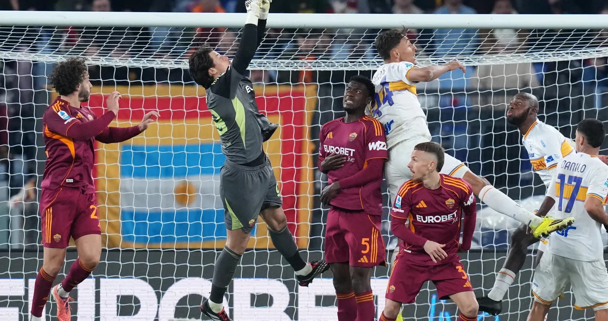 Goalkeeper saves shot during Lecce vs AS Roma match