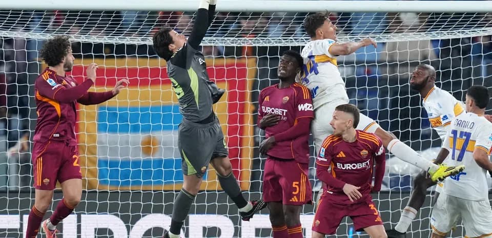 Goalkeeper saves shot during Lecce vs AS Roma match