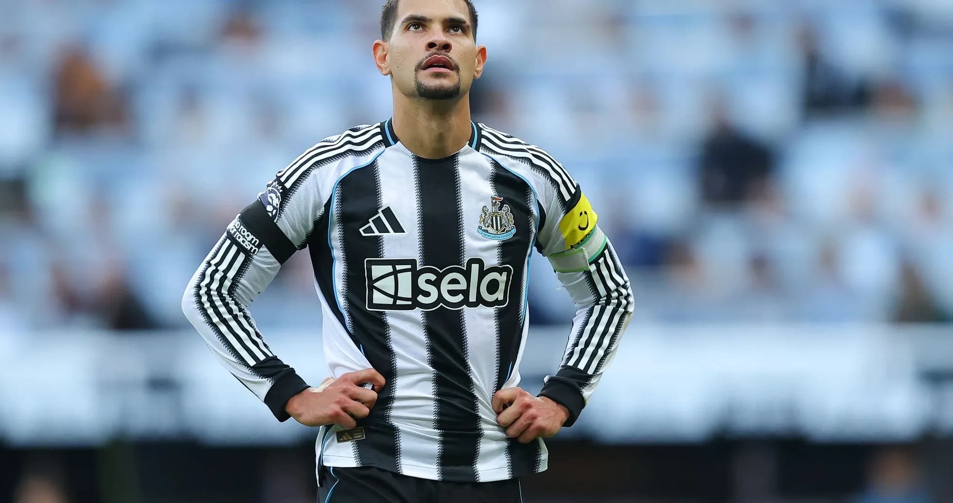 Newcastle player wearing captain's armband on pitch