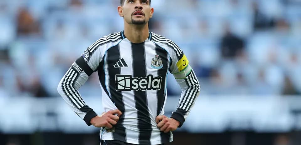 Newcastle player wearing captain's armband on pitch