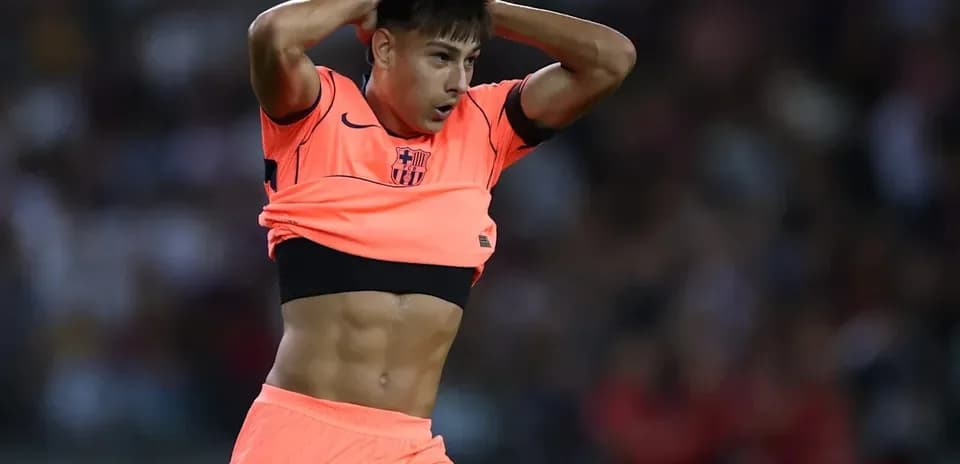 Player adjusting jersey during a football match