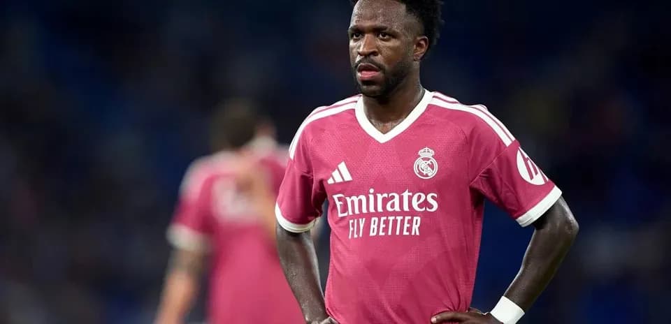 Player wearing pink Real Madrid jersey during match