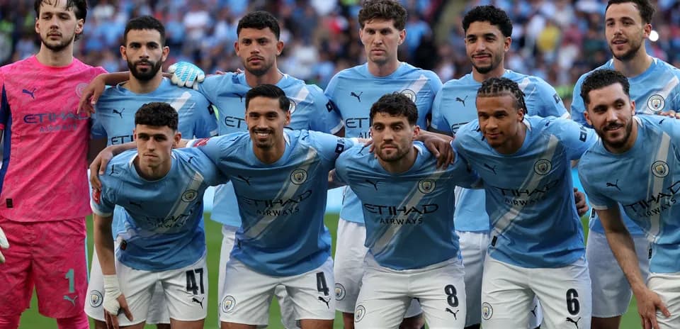 Manchester City team posing before the match