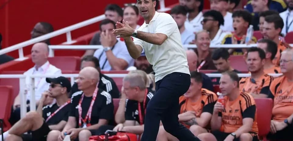 Coach directing players from the sidelines during match