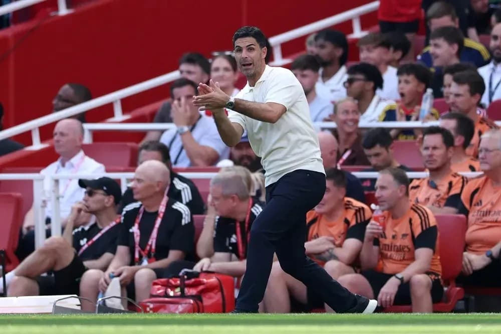 Coach directing players from the sidelines during match
