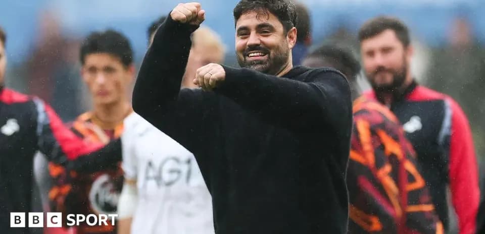 Coach celebrating with players during training session