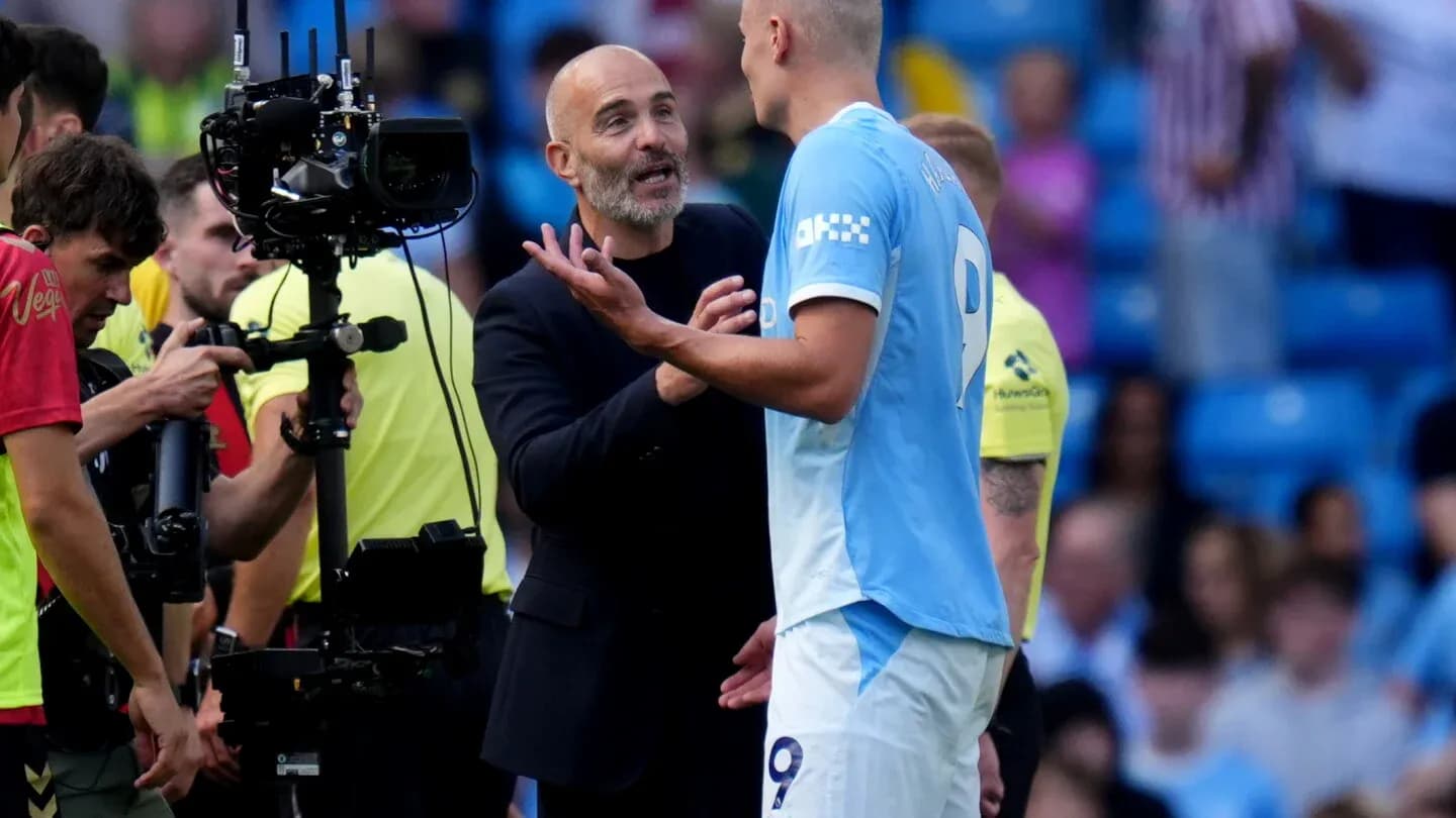 Coach discussing strategy with player during match