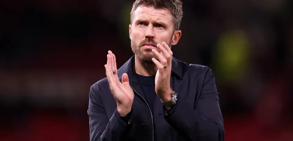 Coach applauding after the match on the pitch