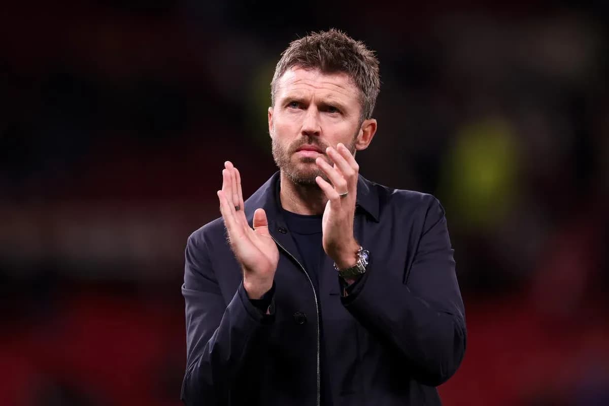 Coach applauding after the match on the pitch