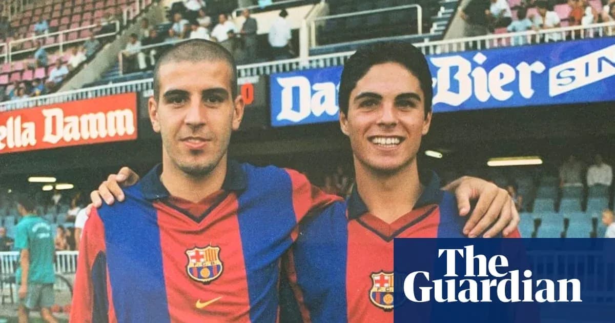 Two young football players in Barcelona jerseys posing together