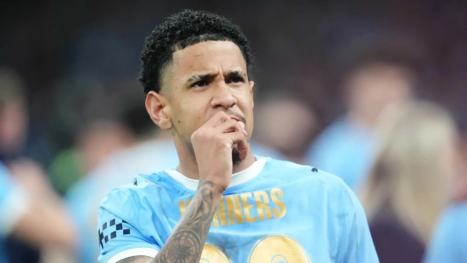 Player in blue jersey contemplating on the field