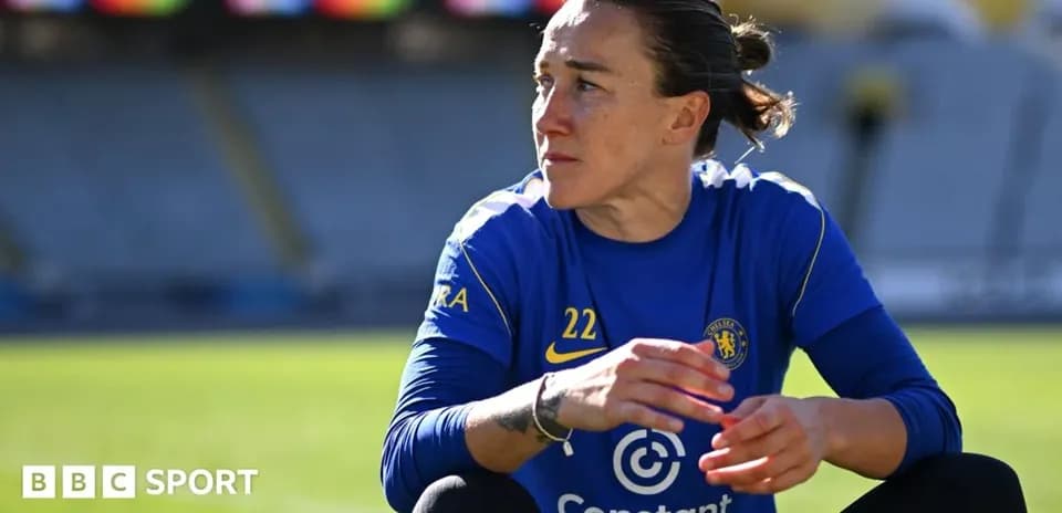 Player in Chelsea kit sitting on the pitch
