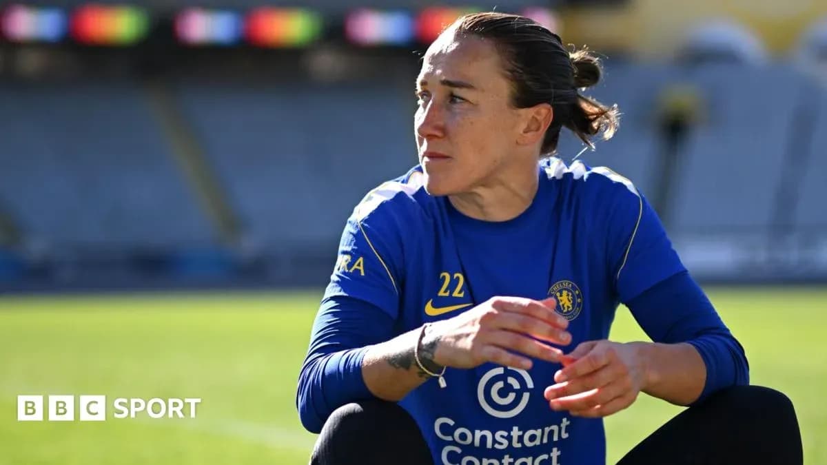 Player in Chelsea kit sitting on the pitch