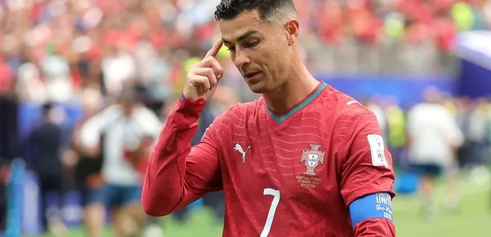 Cristiano Ronaldo touching his forehead during match