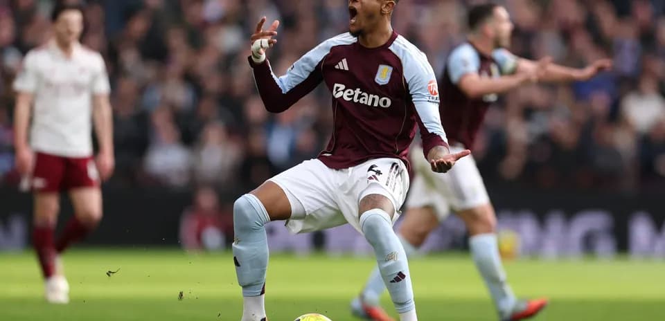 Aston Villa player celebrating during match