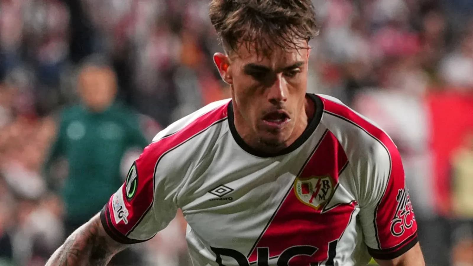 Player in Rayo Vallecano kit during match action