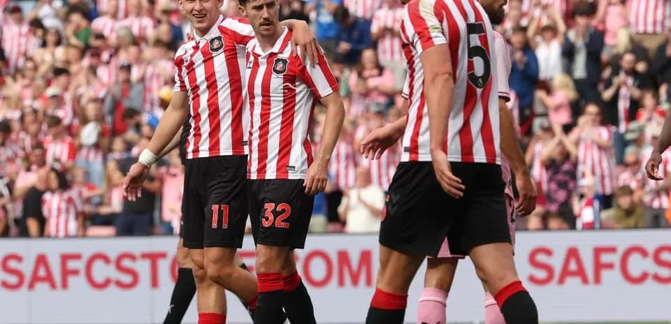 Sunderland players celebrating a goal on the pitch