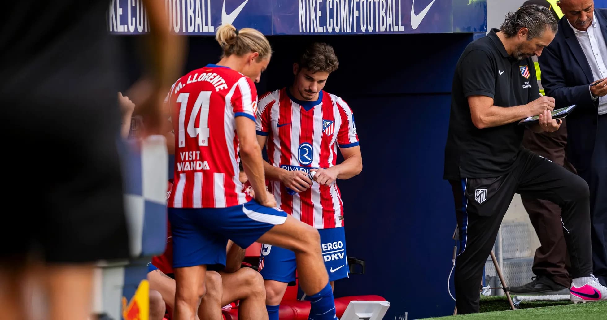 Players and coaching staff on Atletico Madrid bench