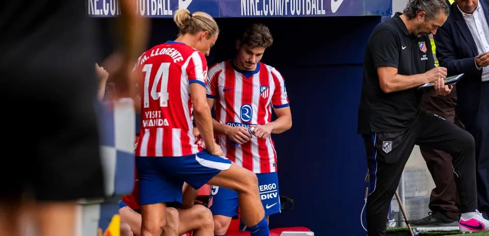 Players and coaching staff on Atletico Madrid bench