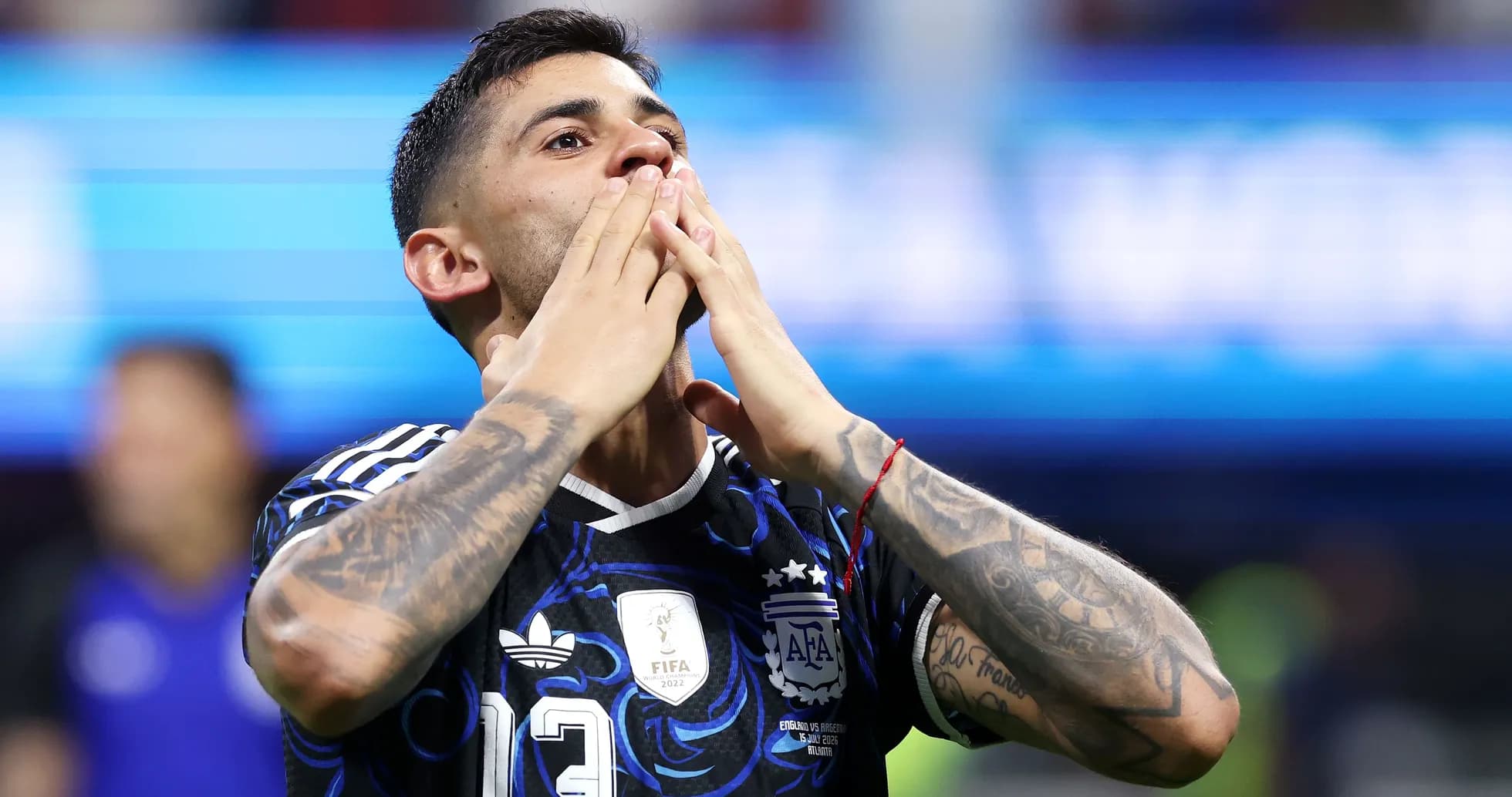 Player celebrating with hands to face in stadium