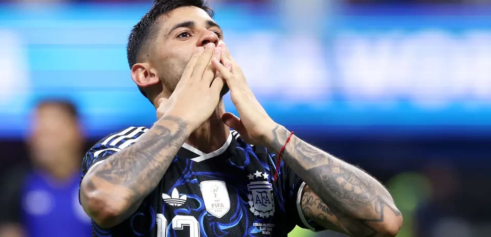 Player celebrating with hands to face in stadium
