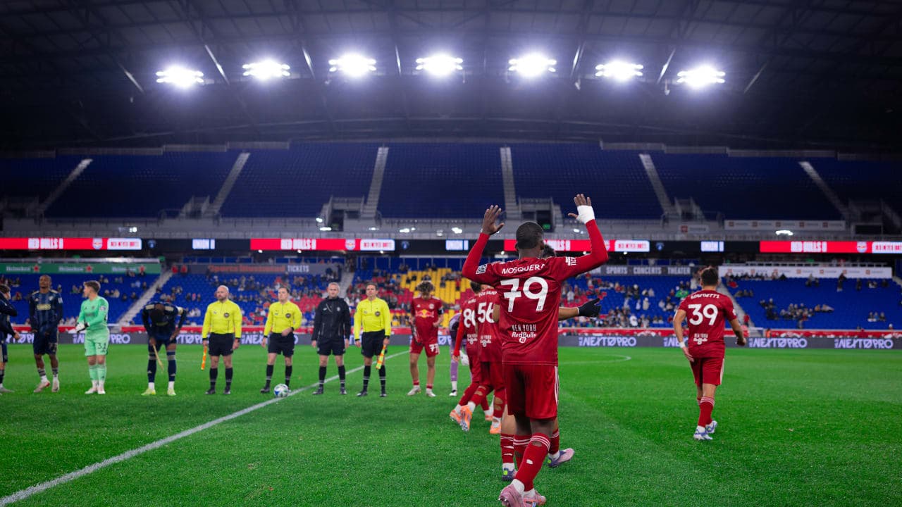 Players greeting fans before the match