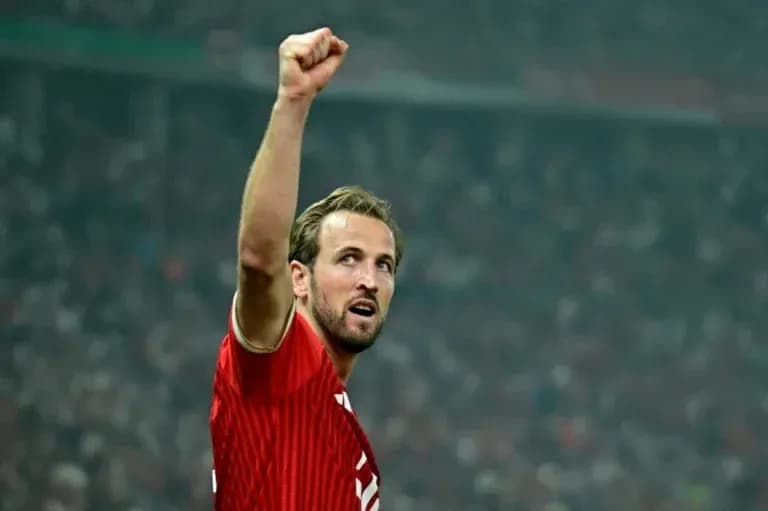 Player celebrating with raised fist in stadium