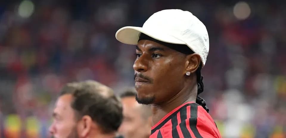 Player wearing a white cap during match observation
