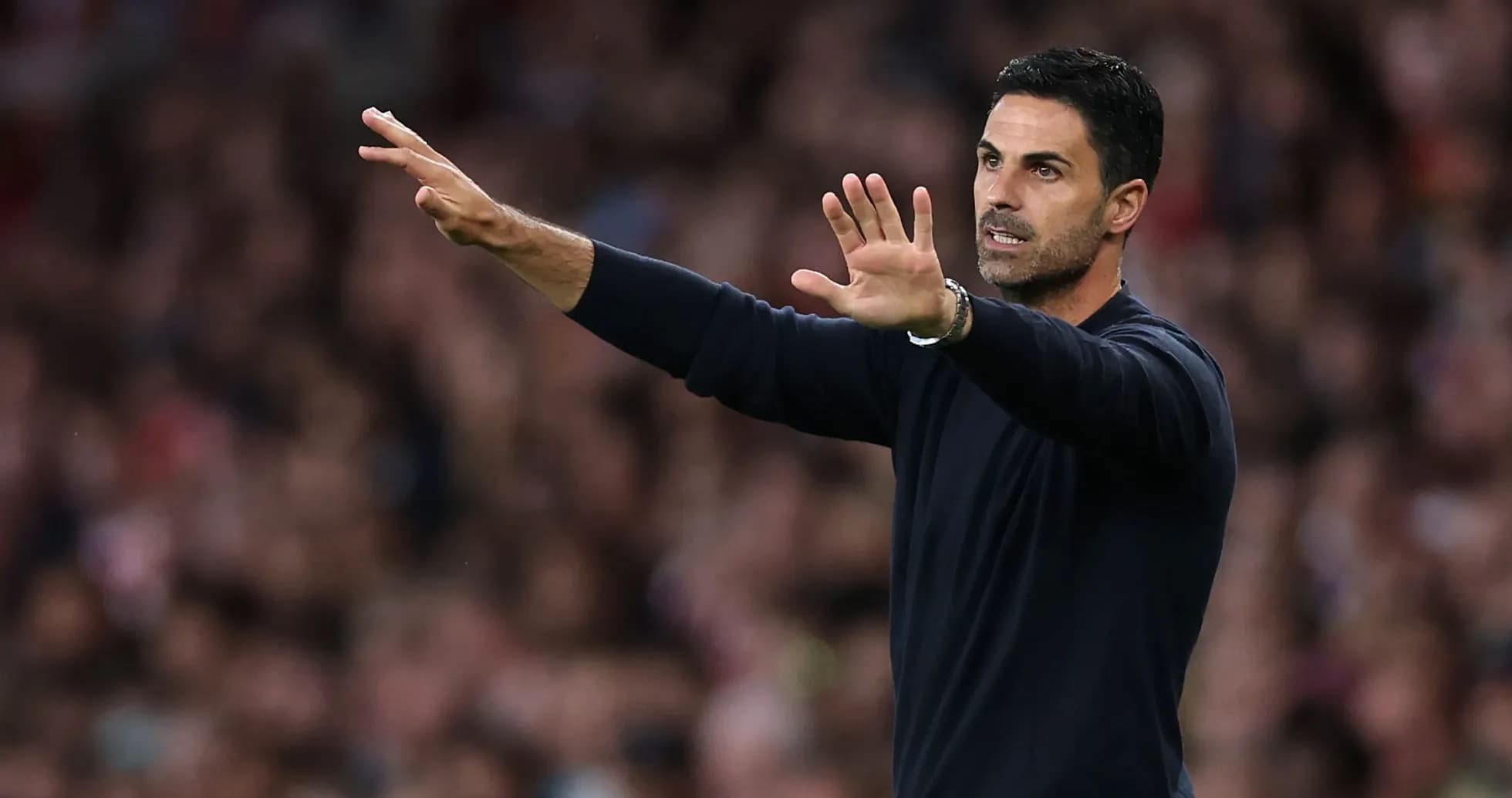 Manager gesturing during match on the sidelines