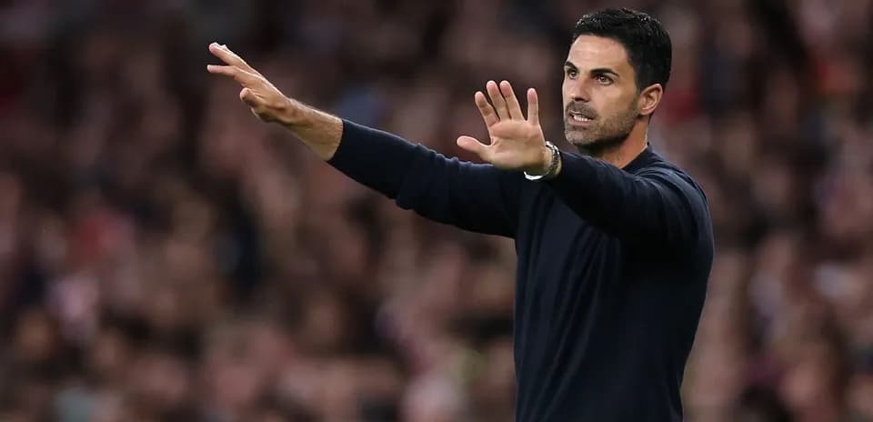 Manager gesturing during match on the sidelines