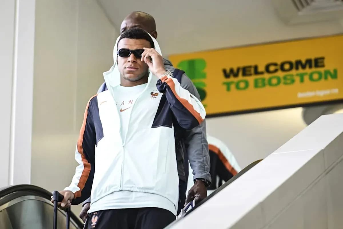 Player arriving in Boston wearing sunglasses and jacket