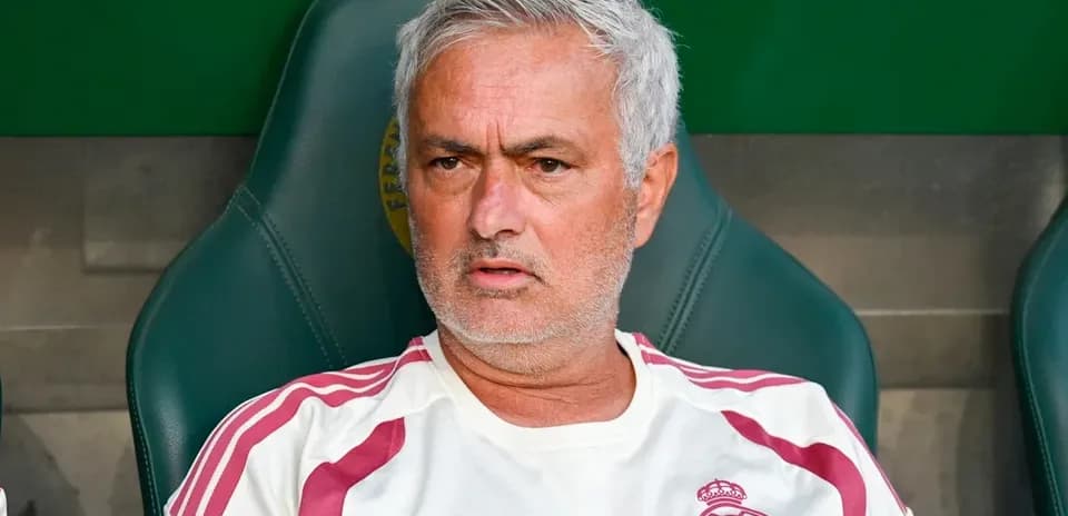Coach sitting on the bench during a match