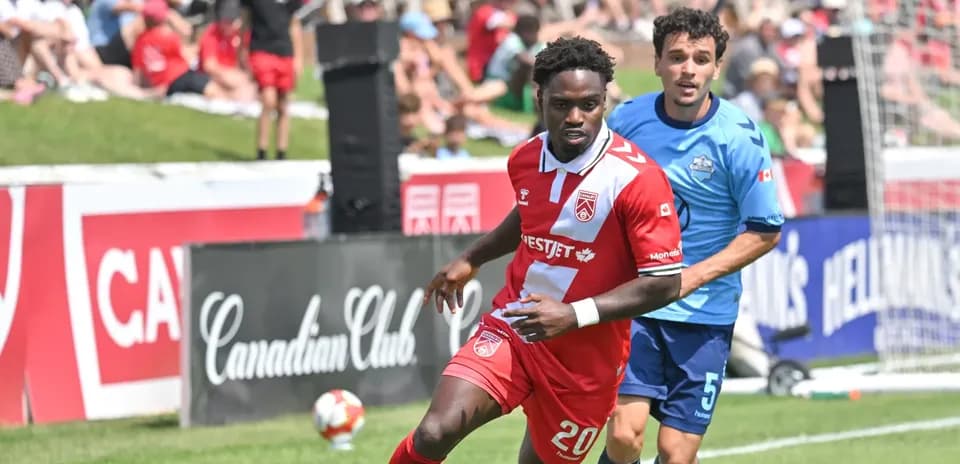 Players competing during HFX Wanderers vs Cavalry match
