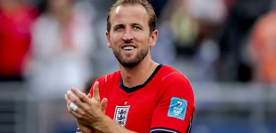 Player applauding while wearing England jersey