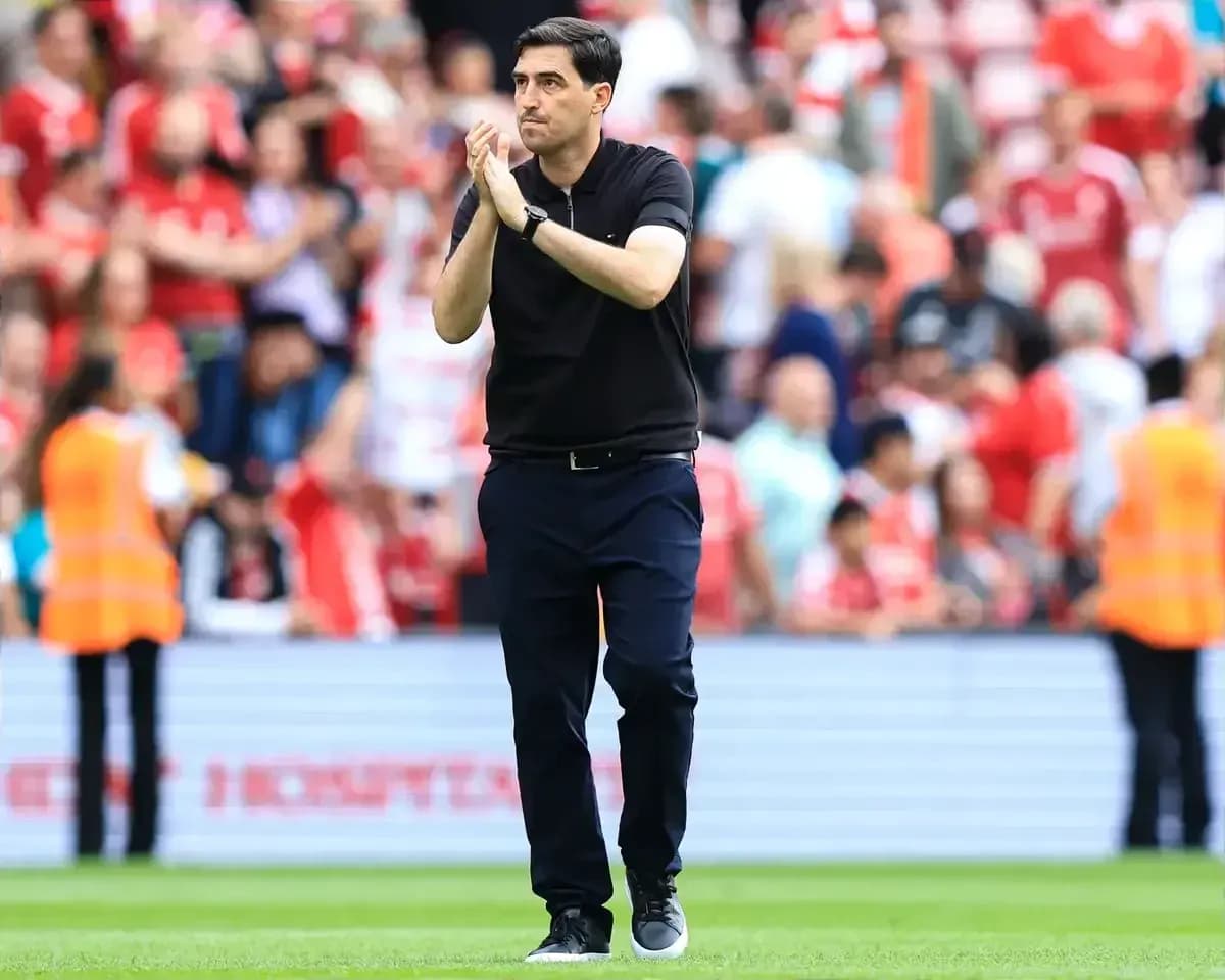 Coach applauding fans after the match